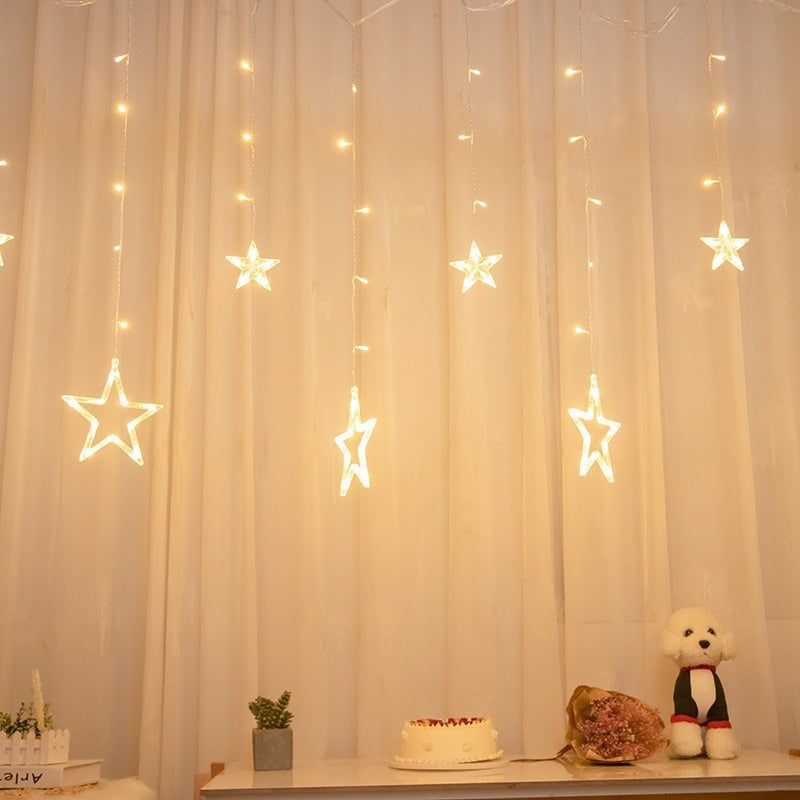 Curtain with star-shaped lights teemdrop