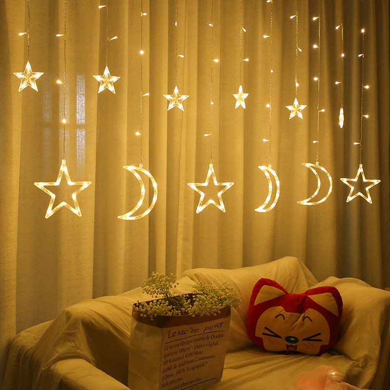Curtain with star-shaped lights teemdrop