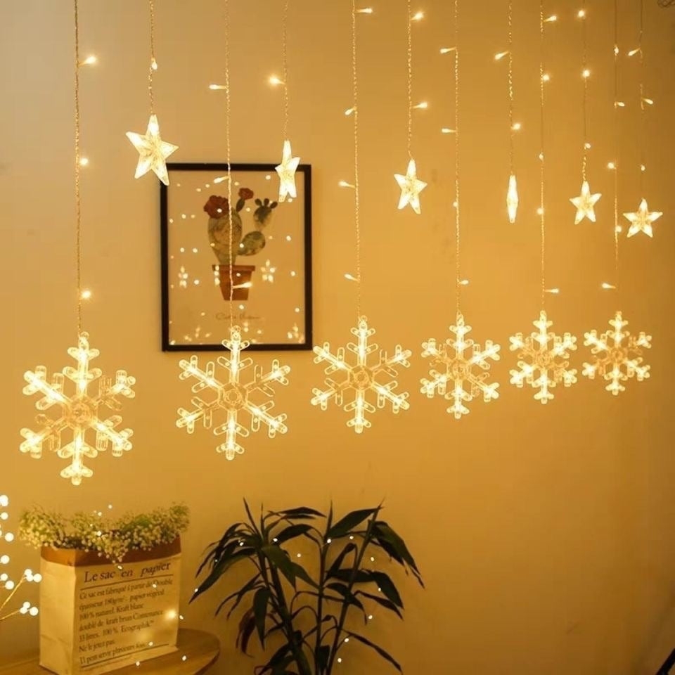 Curtain with star-shaped lights teemdrop
