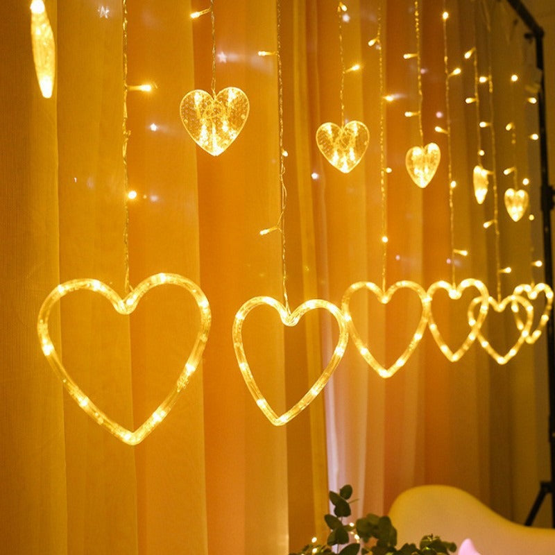 Curtain with star-shaped lights teemdrop