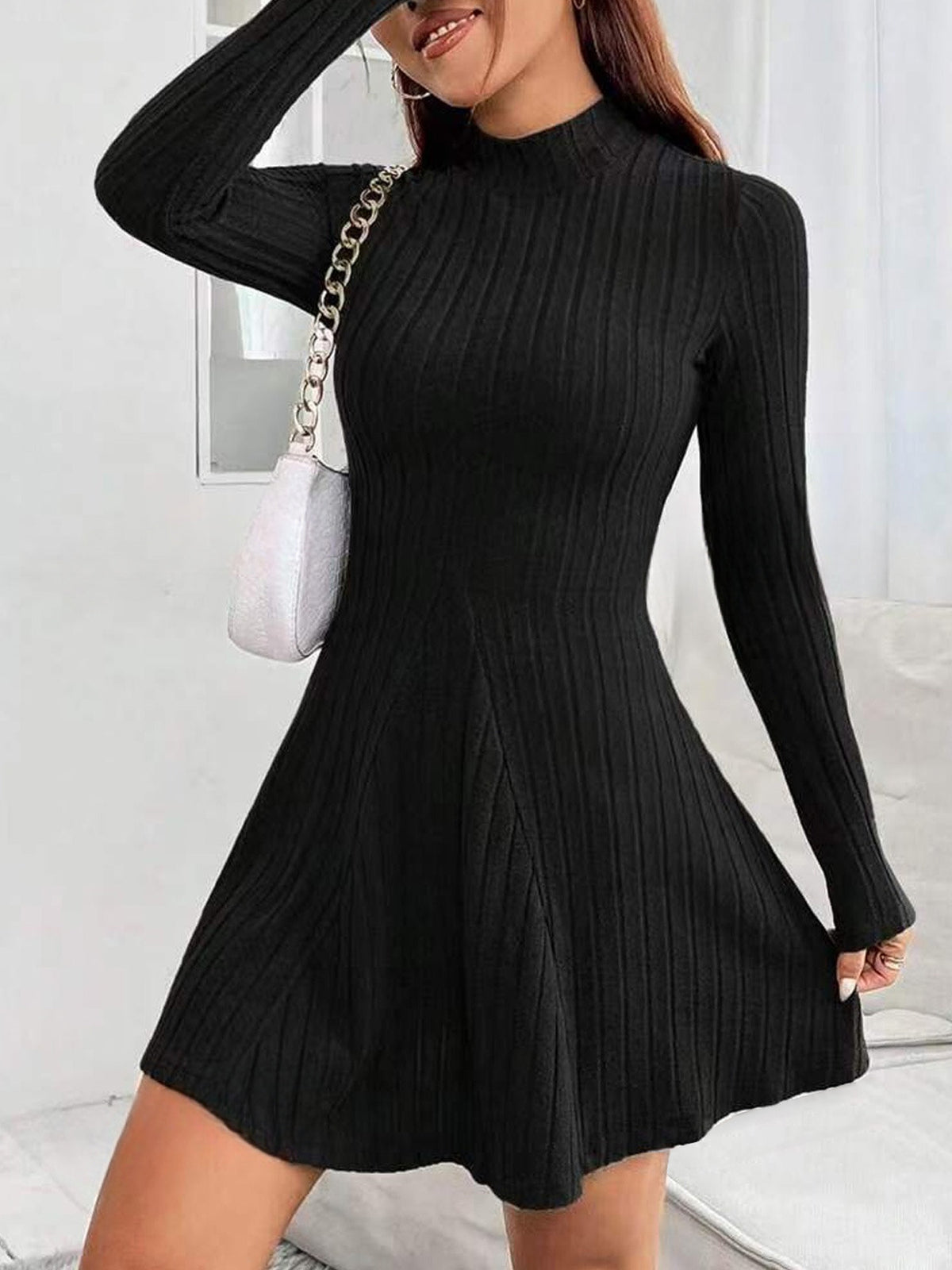 Fitted semi-high neck, waist-cinching long-sleeved dress