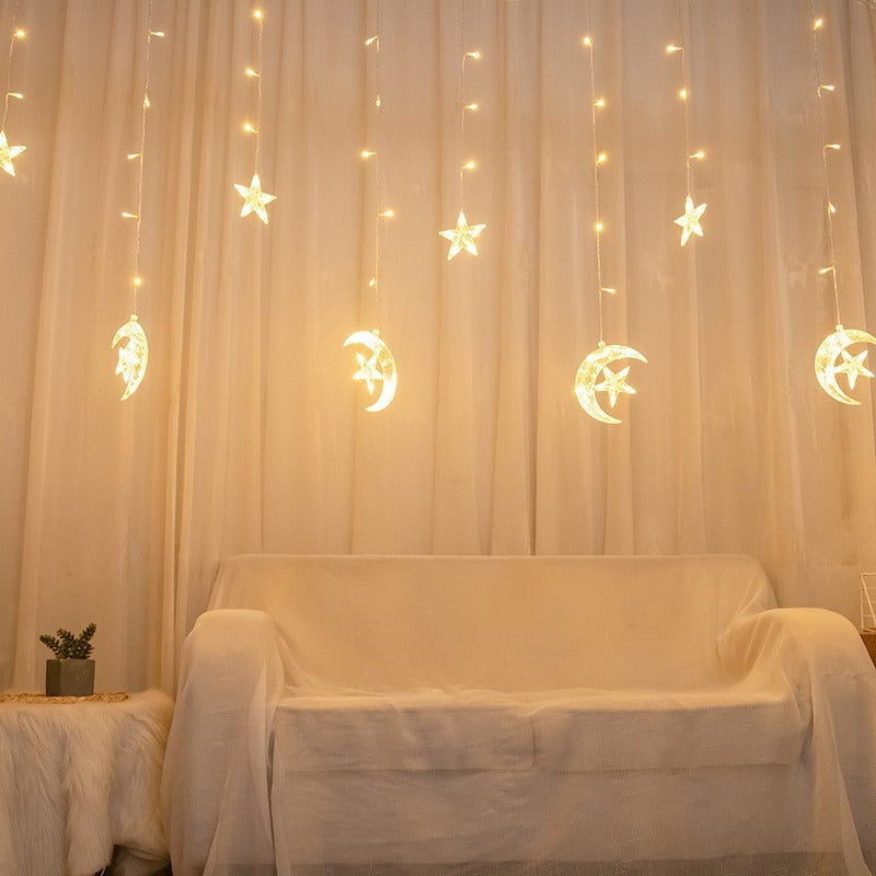 Curtain with star-shaped lights teemdrop