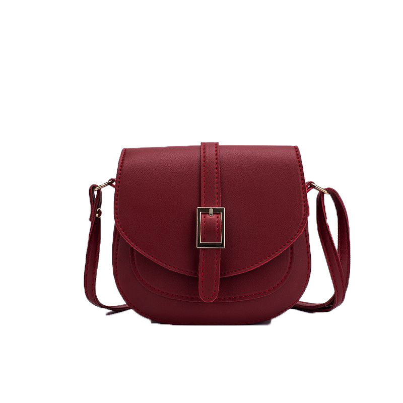 Simple metal-buckle flap crossbody saddle bag with an adjustable shoulder strap.